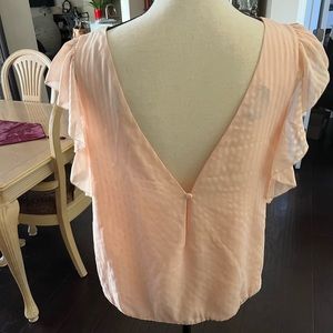 Lovely peach size large Bebe top.